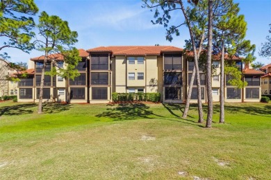 Welcome to your new home in the guard-gated Audubon condominium on Feather Sound Country Club in Florida - for sale on GolfHomes.com, golf home, golf lot