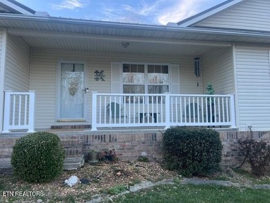 Discover this nicely maintained home on a combined double lot on Lake Tansi Village Country Club in Tennessee - for sale on GolfHomes.com, golf home, golf lot