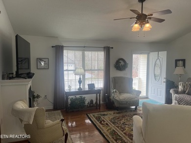 Discover this nicely maintained home on a combined double lot on Lake Tansi Village Country Club in Tennessee - for sale on GolfHomes.com, golf home, golf lot