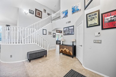 Stunning 4-bedroom, 3-bath home on the golf course in Ahwatukee on The Foothills Golf Club in Arizona - for sale on GolfHomes.com, golf home, golf lot