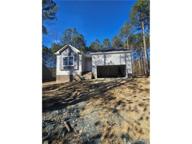 This stunning, brand-new home is nestled in the highly on Carolina Trace Country Club in North Carolina - for sale on GolfHomes.com, golf home, golf lot