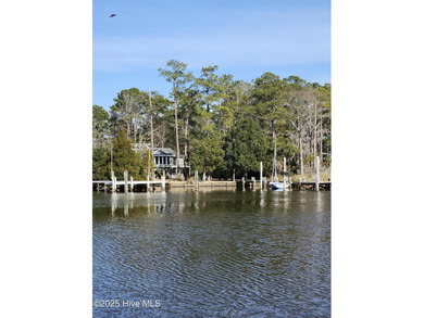Enjoy spectacular sunsets from nearly every room in this on Harbour Point Golf Club in North Carolina - for sale on GolfHomes.com, golf home, golf lot