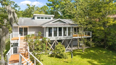 Enjoy spectacular sunsets from nearly every room in this on Harbour Point Golf Club in North Carolina - for sale on GolfHomes.com, golf home, golf lot