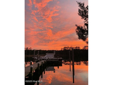 Enjoy spectacular sunsets from nearly every room in this on Harbour Point Golf Club in North Carolina - for sale on GolfHomes.com, golf home, golf lot