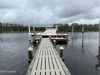Enjoy spectacular sunsets from nearly every room in this on Harbour Point Golf Club in North Carolina - for sale on GolfHomes.com, golf home, golf lot