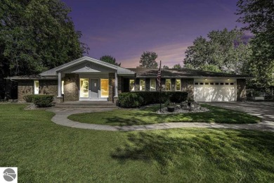 Nestled along the lush greens of Hidden Oaks Golf Course, this on Hidden Oaks Golf Course in Michigan - for sale on GolfHomes.com, golf home, golf lot