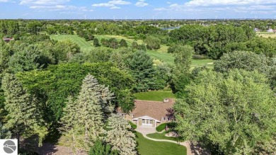 Nestled along the lush greens of Hidden Oaks Golf Course, this on Hidden Oaks Golf Course in Michigan - for sale on GolfHomes.com, golf home, golf lot