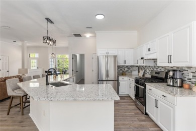 Step inside this beautifully updated 4-bedroom, 2.5-bathroom on Haile Plantation Golf and Country Club in Florida - for sale on GolfHomes.com, golf home, golf lot