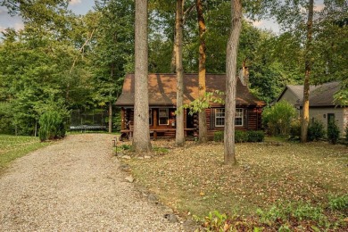 Welcome to this authentic Cape Cod-style log cabin in the heart on Apple Valley Golf Course in Ohio - for sale on GolfHomes.com, golf home, golf lot