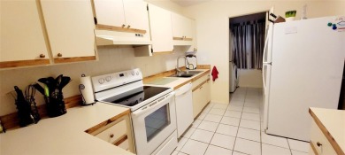 Pond View, spacious second floor furnished 2 bedroom, 2 bath on Tarpon Woods Golf Club in Florida - for sale on GolfHomes.com, golf home, golf lot