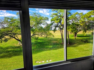 Bright and inviting 1-bedroom, 1.5-bath condo located in the on Hillsboro Pines Golf in Florida - for sale on GolfHomes.com, golf home, golf lot