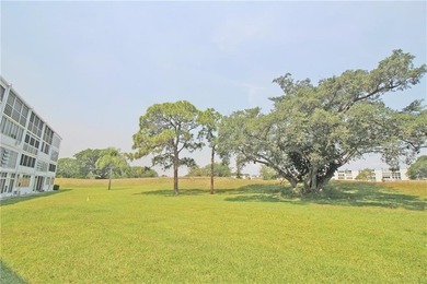 ITS ALL ABOUT THE LANAI & THE VIEWS IN THIS Bright and inviting on Hillsboro Pines Golf in Florida - for sale on GolfHomes.com, golf home, golf lot