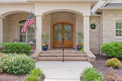 Step into luxury coastal living with this impeccable residence on Members Club At St. James Plantation in North Carolina - for sale on GolfHomes.com, golf home, golf lot