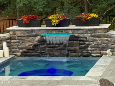 Step into luxury coastal living with this impeccable residence on Members Club At St. James Plantation in North Carolina - for sale on GolfHomes.com, golf home, golf lot