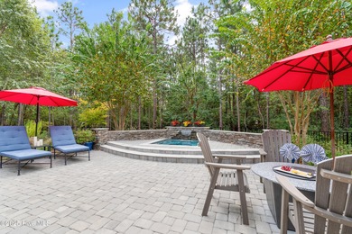 Step into luxury coastal living with this impeccable residence on Members Club At St. James Plantation in North Carolina - for sale on GolfHomes.com, golf home, golf lot