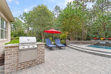 Step into luxury coastal living with this impeccable residence on Members Club At St. James Plantation in North Carolina - for sale on GolfHomes.com, golf home, golf lot