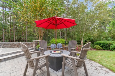 Step into luxury coastal living with this impeccable residence on Members Club At St. James Plantation in North Carolina - for sale on GolfHomes.com, golf home, golf lot