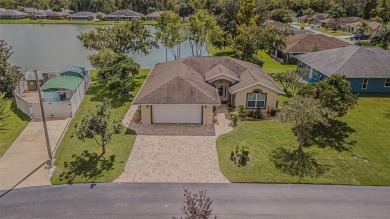 PICTURE PERFECT and perched on a large, serene POND, this on Tampa Bay Golf and Country Club in Florida - for sale on GolfHomes.com, golf home, golf lot