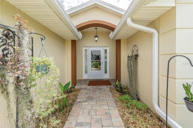 PICTURE PERFECT and perched on a large, serene POND, this on Tampa Bay Golf and Country Club in Florida - for sale on GolfHomes.com, golf home, golf lot