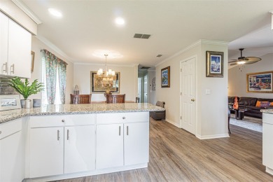 PICTURE PERFECT and perched on a large, serene POND, this on Tampa Bay Golf and Country Club in Florida - for sale on GolfHomes.com, golf home, golf lot