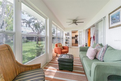 PICTURE PERFECT and perched on a large, serene POND, this on Tampa Bay Golf and Country Club in Florida - for sale on GolfHomes.com, golf home, golf lot