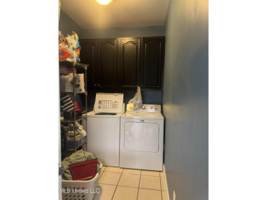 Nestled near the scenic Hickory Hills Golf Course, this charming on Mississippi National Golf Course in Mississippi - for sale on GolfHomes.com, golf home, golf lot