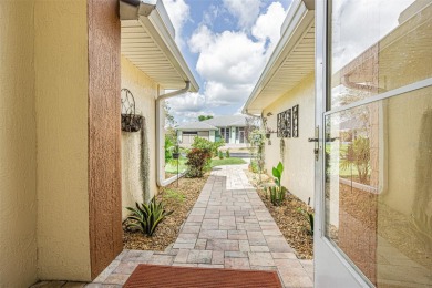 PICTURE PERFECT and perched on a large, serene POND, this on Tampa Bay Golf and Country Club in Florida - for sale on GolfHomes.com, golf home, golf lot