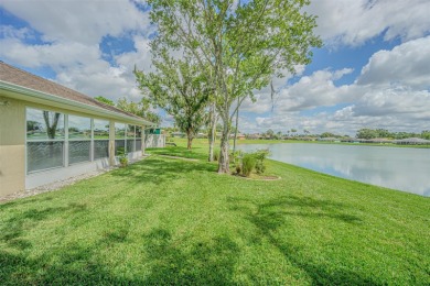 PICTURE PERFECT and perched on a large, serene POND, this on Tampa Bay Golf and Country Club in Florida - for sale on GolfHomes.com, golf home, golf lot