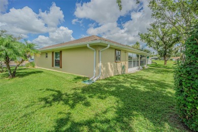 PICTURE PERFECT and perched on a large, serene POND, this on Tampa Bay Golf and Country Club in Florida - for sale on GolfHomes.com, golf home, golf lot
