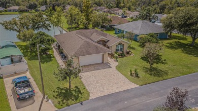 PICTURE PERFECT and perched on a large, serene POND, this on Tampa Bay Golf and Country Club in Florida - for sale on GolfHomes.com, golf home, golf lot