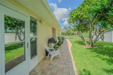 PICTURE PERFECT and perched on a large, serene POND, this on Tampa Bay Golf and Country Club in Florida - for sale on GolfHomes.com, golf home, golf lot