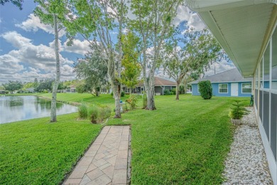 PICTURE PERFECT and perched on a large, serene POND, this on Tampa Bay Golf and Country Club in Florida - for sale on GolfHomes.com, golf home, golf lot