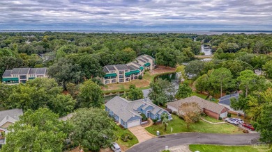 Where the tranquility of the water meets the refinement of on Fairway Oaks at Magnolia Golf Course in Florida - for sale on GolfHomes.com, golf home, golf lot