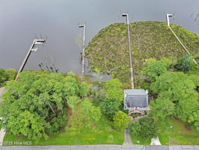 Waterfront homesite with extensive dock frontage in the gated on Harbour Point Golf Club in North Carolina - for sale on GolfHomes.com, golf home, golf lot