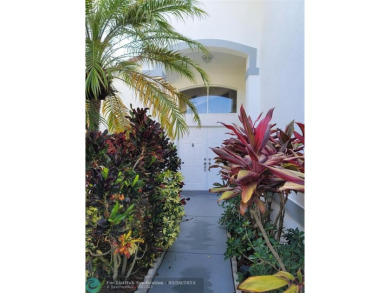 Nestled in the highly sought-after, gated golf course community on Atlantic National Golf and Country Club in Florida - for sale on GolfHomes.com, golf home, golf lot
