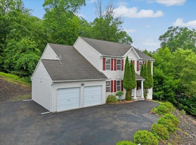 Discover this beautifully maintained 4-bedroom, 3-bath Colonial on Country Club of the Poconos Golf Course in Pennsylvania - for sale on GolfHomes.com, golf home, golf lot