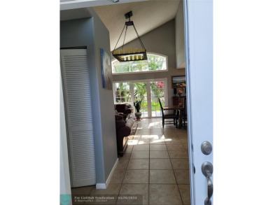 Nestled in the highly sought-after, gated golf course community on Atlantic National Golf and Country Club in Florida - for sale on GolfHomes.com, golf home, golf lot