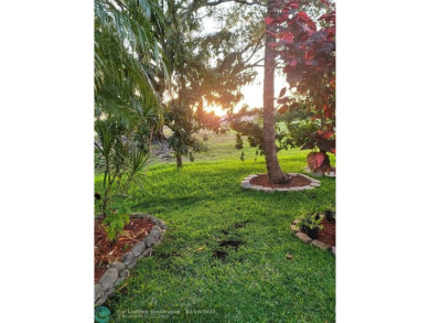 Nestled in the highly sought-after, gated golf course community on Atlantic National Golf and Country Club in Florida - for sale on GolfHomes.com, golf home, golf lot