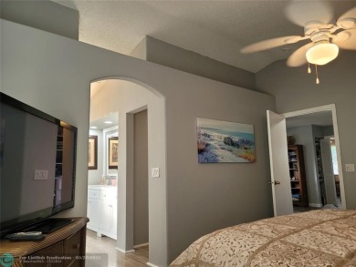 Nestled in the highly sought-after, gated golf course community on Atlantic National Golf and Country Club in Florida - for sale on GolfHomes.com, golf home, golf lot
