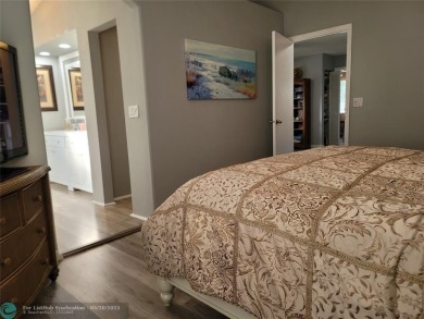 Nestled in the highly sought-after, gated golf course community on Atlantic National Golf and Country Club in Florida - for sale on GolfHomes.com, golf home, golf lot