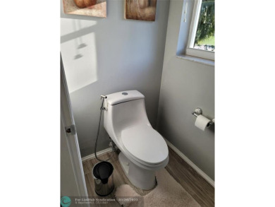 Nestled in the highly sought-after, gated golf course community on Atlantic National Golf and Country Club in Florida - for sale on GolfHomes.com, golf home, golf lot