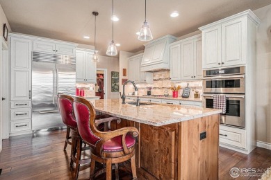 This stunning custom home is nestled at the end of a serene on Highland Meadows Golf Course in Colorado - for sale on GolfHomes.com, golf home, golf lot