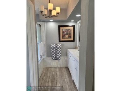 Nestled in the highly sought-after, gated golf course community on Atlantic National Golf and Country Club in Florida - for sale on GolfHomes.com, golf home, golf lot