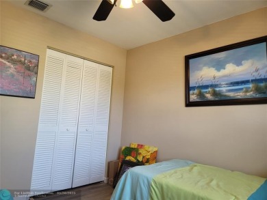Nestled in the highly sought-after, gated golf course community on Atlantic National Golf and Country Club in Florida - for sale on GolfHomes.com, golf home, golf lot
