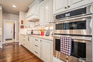 This stunning custom home is nestled at the end of a serene on Highland Meadows Golf Course in Colorado - for sale on GolfHomes.com, golf home, golf lot