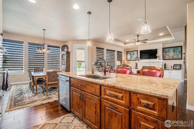 This stunning custom home is nestled at the end of a serene on Highland Meadows Golf Course in Colorado - for sale on GolfHomes.com, golf home, golf lot
