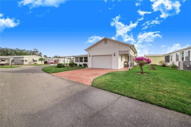 Welcome to this stunning home in a sought-after 55+ resort-style on Sweetwater Golf and Tennis Club in Florida - for sale on GolfHomes.com, golf home, golf lot