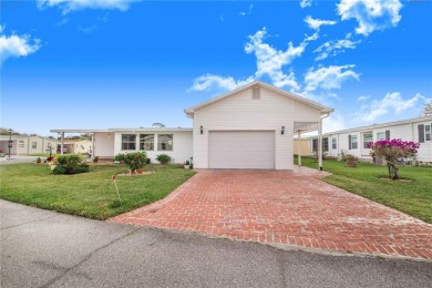 Welcome to this stunning home in a sought-after 55+ resort-style on Sweetwater Golf and Tennis Club in Florida - for sale on GolfHomes.com, golf home, golf lot