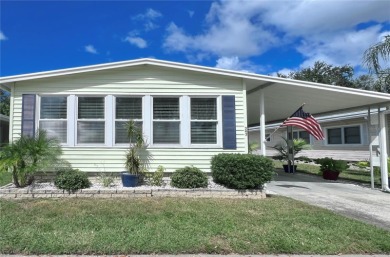 This stunning, partically furnished residence offers an inviting on Fairway Village Golf Course in Florida - for sale on GolfHomes.com, golf home, golf lot