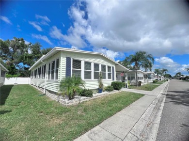 This stunning, partically furnished residence offers an inviting on Fairway Village Golf Course in Florida - for sale on GolfHomes.com, golf home, golf lot